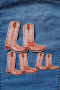Denim fabric with cowboy boot design and 'Lola' text